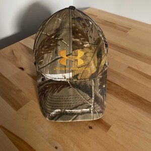 UNDER ARMOUR CAMO HAT W/ ORANGE EMBLEM, SZ LARGE